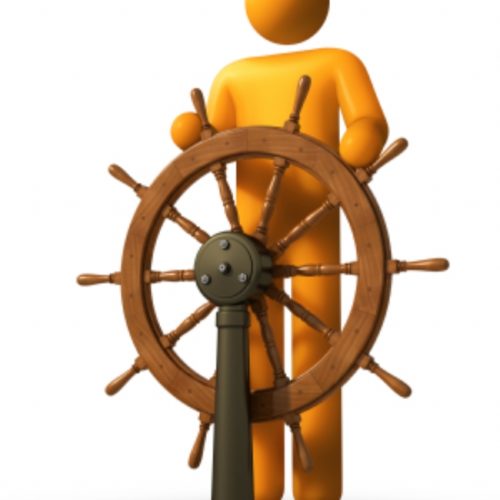 man at ship wheel