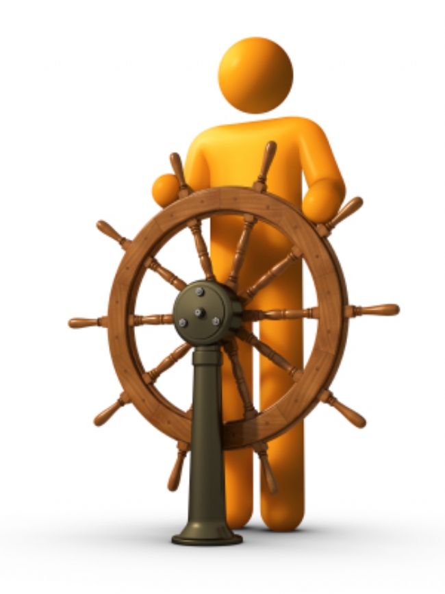 man at ship wheel